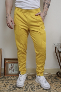 Calça ADIDAS amarela classica listras na internet