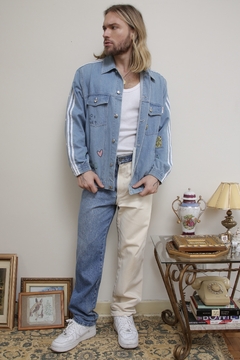 Calça Bicolor jeans com off
