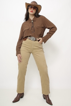 Calça jeans western bolso recorte couro