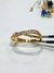 Anillo cruzado acero dorado