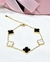 Pulsera acero dorado trebol blanco y negro en internet