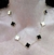 Collar acero dorado trebol blanco negro - tienda online
