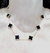 Collar acero dorado trebol negro - tienda online
