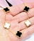 Imagen de Pulsera acero dorado trebol blanco y negro