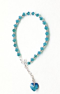 PULSERA SWAROVSKI CON BOLITAS - CELESTE METALICO