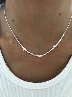 Cadena choker con bolitas y estrella en internet
