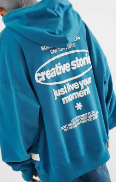 Buzo canguro over creative petroleo - comprar online