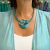 Collar de mujer color turquesa con dije redondo