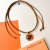 Collar Annie Camel Naranja 176 - comprar online