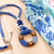 Collar largo color azul con dije en forma de dona