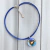 Collar con cordón de cuero azul y dije de vitro fusión redondo azul y celeste
