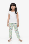 Pantalón "H&M" - Tipo babucha verde con unicornios y arco iris