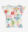 Remera H&M - Con flores rojas, azules, verdes y rosas. Volado en los hombros