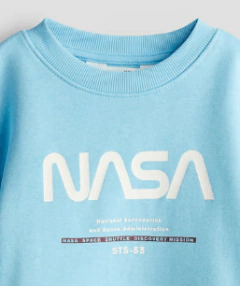 Buzo "H&M". Con frisa, celeste con NASA en internet
