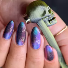 Imã caveira duocolor dourado/preto cilindrico. na internet