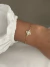 Pulseira estrela com zircônias de aço inox dourado