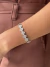 Bracelete trevos cravejados e vazados banhado a prata
