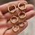 Argollas click acero dorado