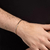 552054 Pulseira Rommanel bracelete folheada a ouro aro torcido 7,3 cm