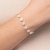 552113 Pulseira Rommanel folheada a ouro fio com pérolas barrocas