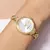 650107 Relógio Rommanel dourado analógico redondo com pulseira e cristais