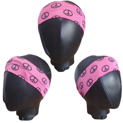 Vincha bandana de algodón y spandex color rosa con símbolo de paz, vista desde diferentes ángulos.