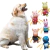 Un perro de raza Golden Retriever sonríe junto a coloridos juguetes con chifle en forma de animalitos.