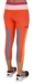 Calzas adidas Climalite para mujer, de color naranja con detalles en azul y franja blanca en la cintura, vistas desde atrás.