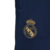 Logo del Real Madrid bordado en un pantalón jogger azul para hombre.