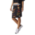 Pollera adidas Originals Slim de Rita Ora en diseño negro con detalles coloridos, combinada con una camiseta negra y zapatillas blancas.