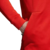 Detalle de la campera adidas Zne selección de fútbol España, en color rojo, mostrando la manga y el bolsillo frontal.
