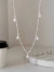 Choker Correntaria Vazada Detalhada com Elos Lisos e Mini Gota Zircônia Pendurada ( Folheado a Ouro 18K e Prata 925 ) na internet