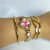 Relógio Inspiração Trevo Luxo com Pedras Rosa Claro Aço Dourado e Steel na internet