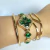 Relógio Inspiração Trevo Luxo com Pedras Verde Esmeralda Aço Dourado e Steel na internet