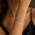 Bracelete Aro Aberto Fileira com Zircônia e Mini Borboleta Cravejada Central ( Folheado a Ouro 18K e Ródio ) - comprar online