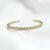 Bracelete Efeito Pouco Ondulado com 1 Fileira Baguete Zircônia Central Folheado a Ouro 18K e Ródio - comprar online