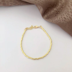 Pulseira canutilhos lisos banhado a ouro - Chris Sugano Semijoias