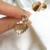 Brinco shell gold na internet