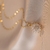 Collar Flor Girasol Giratorio (Acero) - tienda online