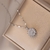 Imagen de Collar Flor Girasol Giratorio (Acero)