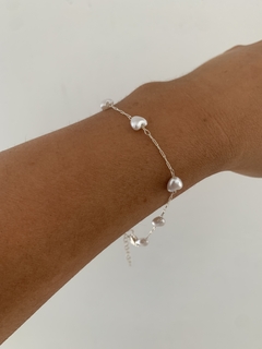 Pulsera de acero blanco con corazones