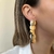 BR225D PAR DE BRINCOS FLUIR FOLHEADO A OURO 18K