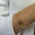PL112D - BRACELETE TORCIDO FECHADO FOLHEADO A OURO 18K
