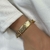 PL130 - PULSEIRA PINGENTE FÉ FOLHEADO A OURO