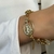 PL128 - PULSEIRA PINGENTE NOSSA SENHORA FOLHEADO A OURO