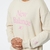 BUZO DAMA NEW BALANCE ESSENTIALS CELEBRATE FLEECE en internet
