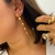 Brinco pêndulo esferas lisas banhado a ouro 18k - comprar online