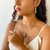 Conjunto Colar, Brincos, Bracelete e Anel retangular turmalina com flores e borboleta banhado a ouro 18k na internet