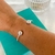 Bracelete aro com esferas lisas banhado a prata na internet