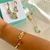 Conjunto Colar, Brincos, Bracelete e Anel retangular turmalina com flores e borboleta banhado a ouro 18k - loja online